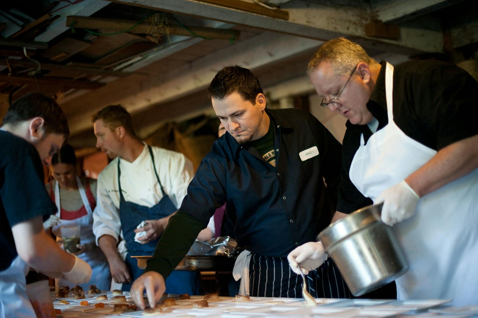 The Chef & Co. cooking team plating together for an event